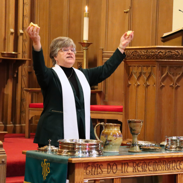 Pastor Trudy Breaking Bread.