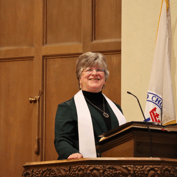 Pastor Trudy Smiling while at the Pulpit